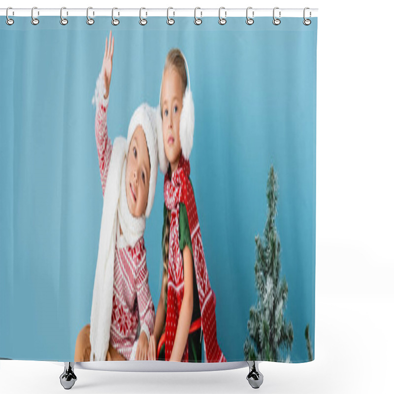 Personality  Panoramic Concept Of Boy Waving Hand Near Girl In Winter Outfit Sitting Near Pine On Blue Shower Curtains