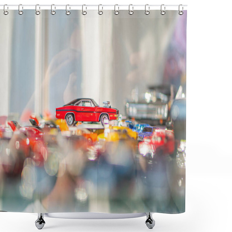 Personality  A Collection Of Toy Cars Is Arranged On A Shelf Or Table, With One Standout Vehicle Prominently Displayed Due To Its Larger Size, Red Color, And Disti Kyiv, Ukraine 06-06-2024 Shower Curtains