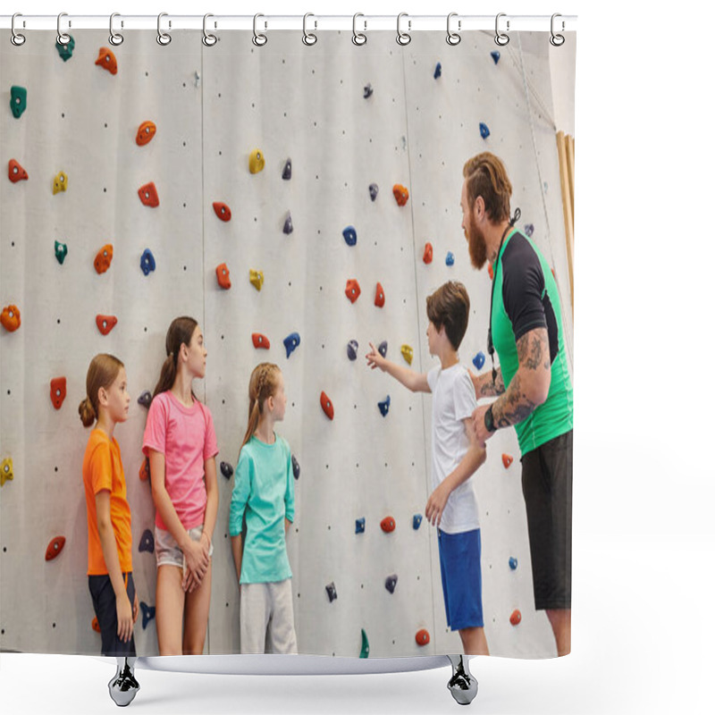 Personality  A Man Teaches A Group Of Diverse Children How To Climb On A Rock Wall In A Bright, Lively Classroom Setting. Shower Curtains