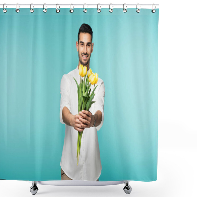 Personality  Smiling Arabian Man Holding Yellow Flowers Isolated On Blue  Shower Curtains