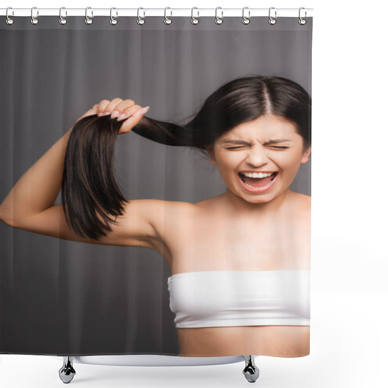 Personality  Upset Brunette Woman Holding Damaged Hair And Yelling Isolated On Black Shower Curtains