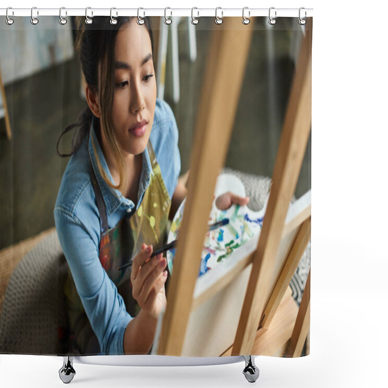 Personality  A Young Asian Artist, Wearing An Apron, Paints On A Canvas In Her Workshop. Shower Curtains