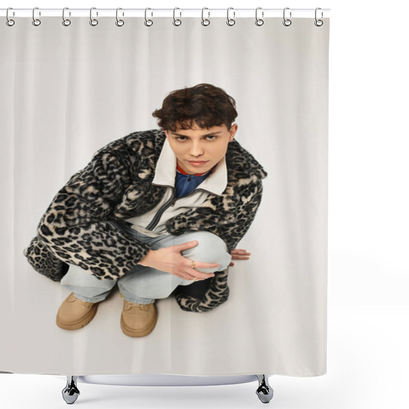 Personality  Handsome Man In Trendy Outfit Poses Thoughtfully While Crouching On A Clean Backdrop. Shower Curtains