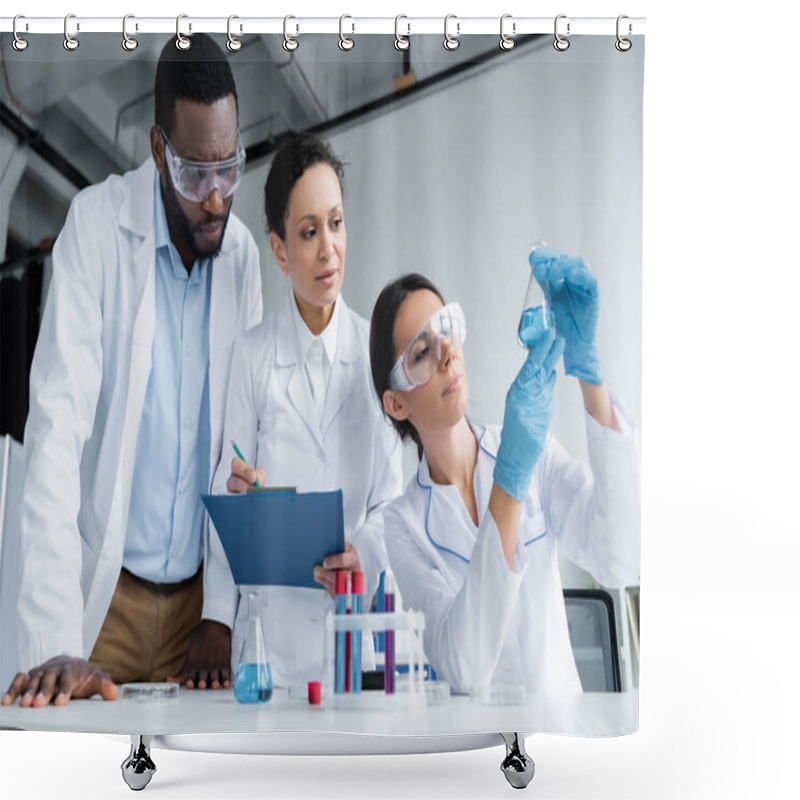 Personality  Interracial Scientists In Safety Goggles With Clipboard Looking At Reagent In Flask  Shower Curtains