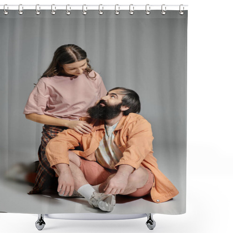 Personality  A Couple Sits In A Studio Setting, The Woman In A Pink Shirt And Plaid Pants, The Man In An Orange Jacket And Shorts, Looking At Each Other With Love. Shower Curtains