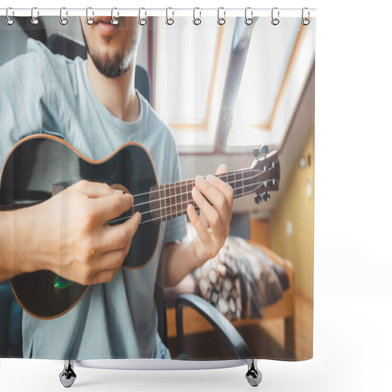 Personality  Close-up Of A Man Playing A Black Ukulele Under Natural Light Streaming Through Skylights. Enjoying The Feeling Of Playing The Ukulele And Immersing Oneself In The Creative Spirit. Shower Curtains