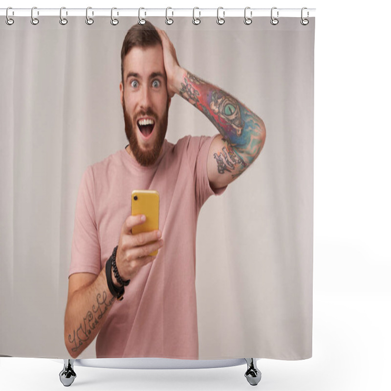 Personality  Overjoyed Attractive Blue-eyed Young Unshaved Man With Tattooes Clutching His Head With Raised Hand And Looking At Camera With Surprised Face, Isolated Over White Background Shower Curtains