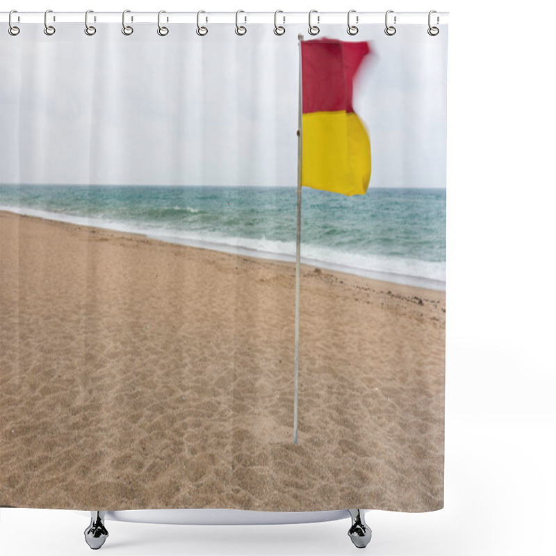 Personality  Red And Yellow Warning Flag Flying In The Wind On A Deserted Sandy Beach With Choppy Ocean On A Grey Sky Day Shower Curtains