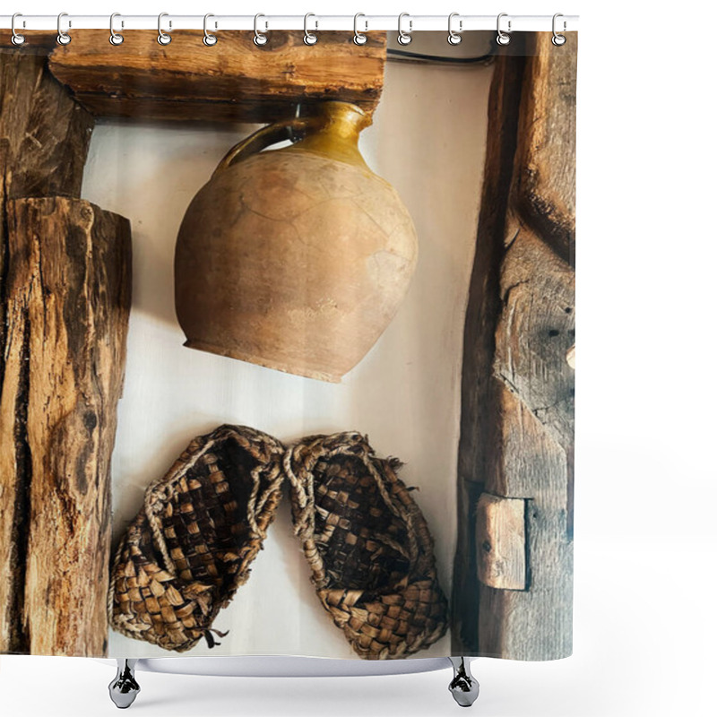 Personality  A Rustic Clay Jug And Traditional Woven Sandals Hang On An Aged Wooden Wall, Creating A Charming Vintage Atmosphere. Ideal For Themes Of History, Craftsmanship, And Nostalgia. Shower Curtains