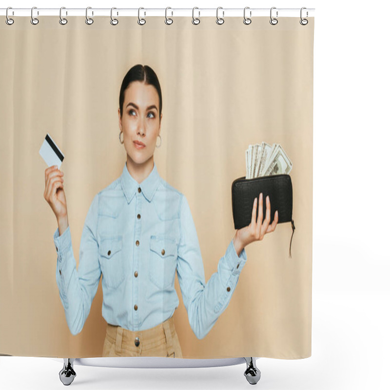 Personality  Pensive Brunette Woman In Denim Shirt Holding Wallet With Dollars And Credit Card Isolated On Beige Shower Curtains