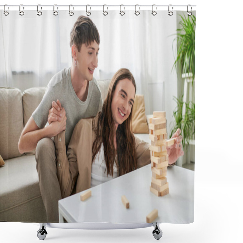 Personality  Young And Smiling Same Sex Couple In Casual Clothes Holding Hands While Playing Wood Blocks Game Near Parts On Table In Living Room At Home  Shower Curtains