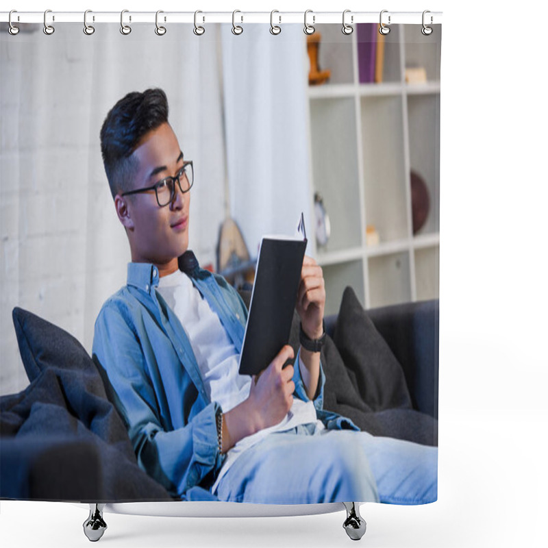 Personality  Handsome Smiling Young Man In Eyeglasses Sitting On Couch And Reading Book  Shower Curtains