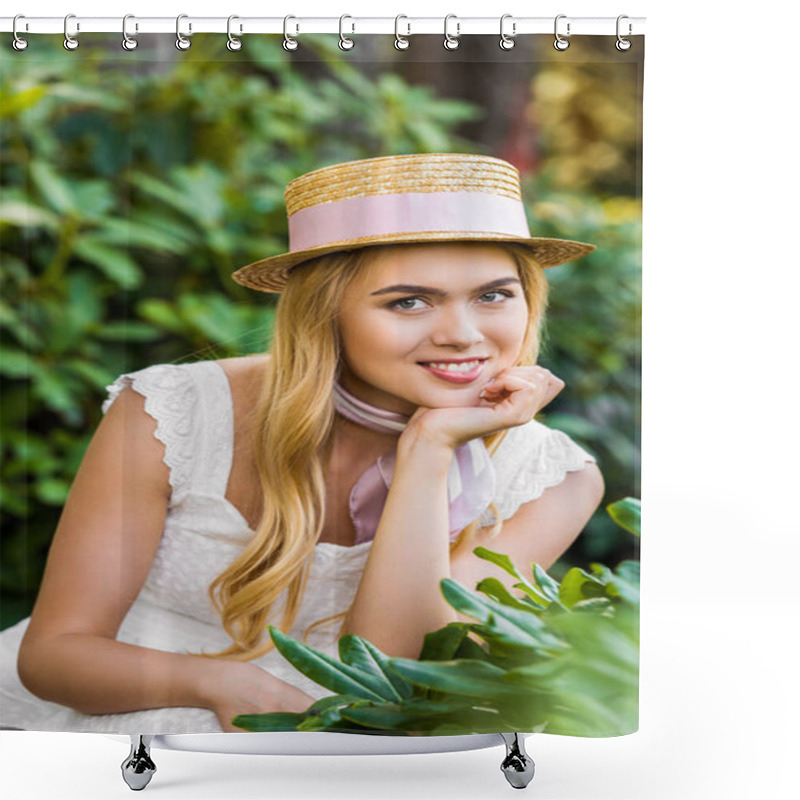 Personality  Portrait Of Beautiful Young Blonde Woman In Wicker Hat With Ribbon Smiling At Camera Between Green Plants Shower Curtains