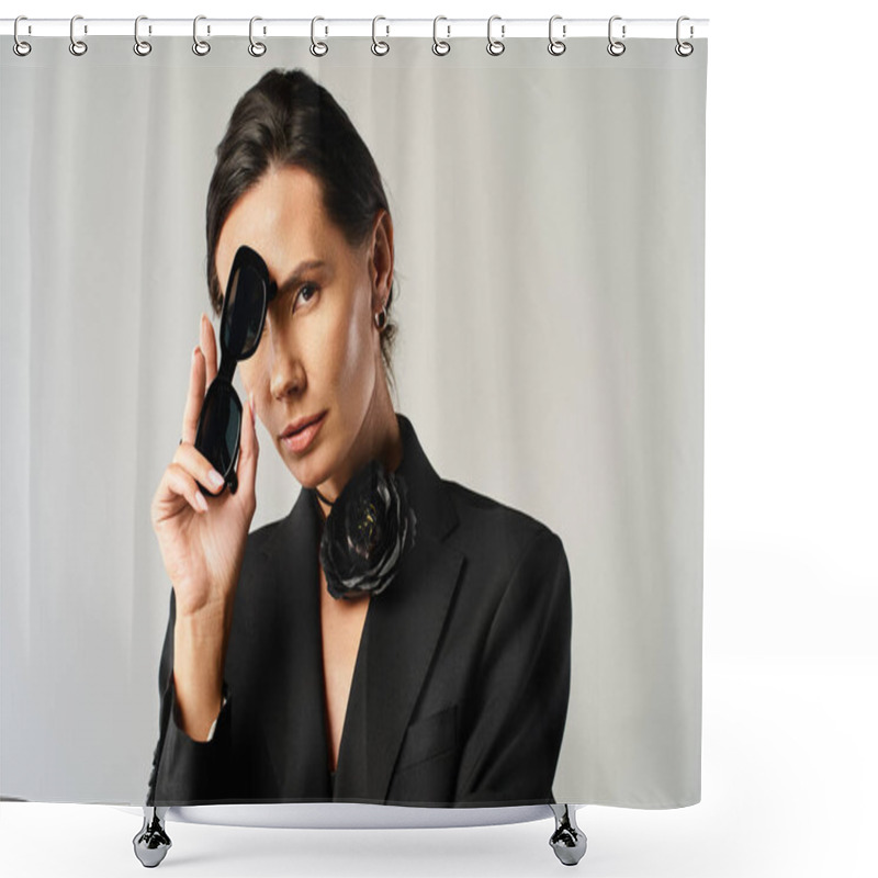 Personality  A Stylish Woman In A Suit Confidently Holds A Pair Of Black Sunglasses In A Studio Setting Shower Curtains