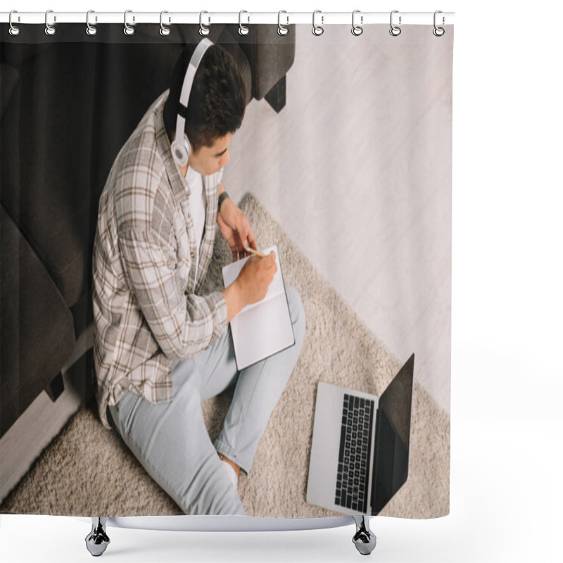 Personality  Overhead View Of Young Man In Headphones Sitting On Floor Near Laptop And Writing In Notebook Shower Curtains