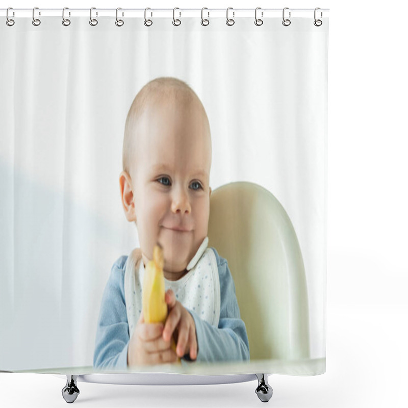 Personality  Selective Focus Of Smiling Baby Holding Banana While Sitting On Feeding Chair On White Background Shower Curtains