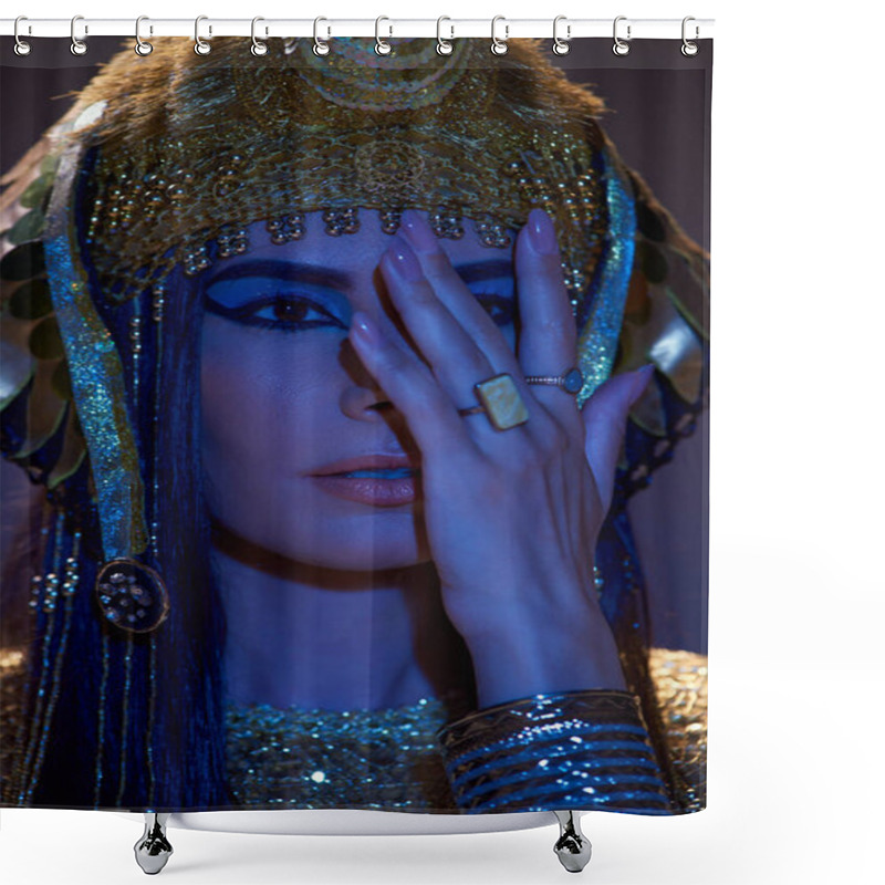 Personality  Portrait Of Woman In Egyptian Headdress Covering Face And Posing On Brown Background With Blue Light Shower Curtains