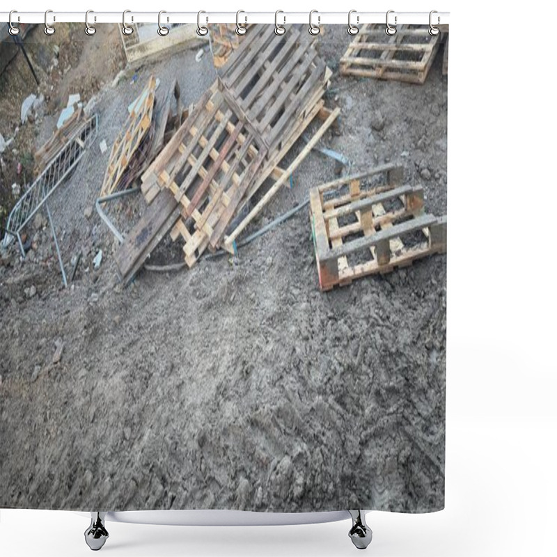 Personality  Discarded Wooden Pallets And A Damaged Metal Fence Lie On Muddy Ground. The Scene Appears To Be A Construction Or Demolition Site.  The Pallets Are Weathered And Scattered. Shower Curtains