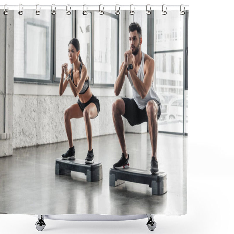 Personality  Concentrated Athletic Young Couple In Sportswear Squatting On Step Platforms In Gym Shower Curtains