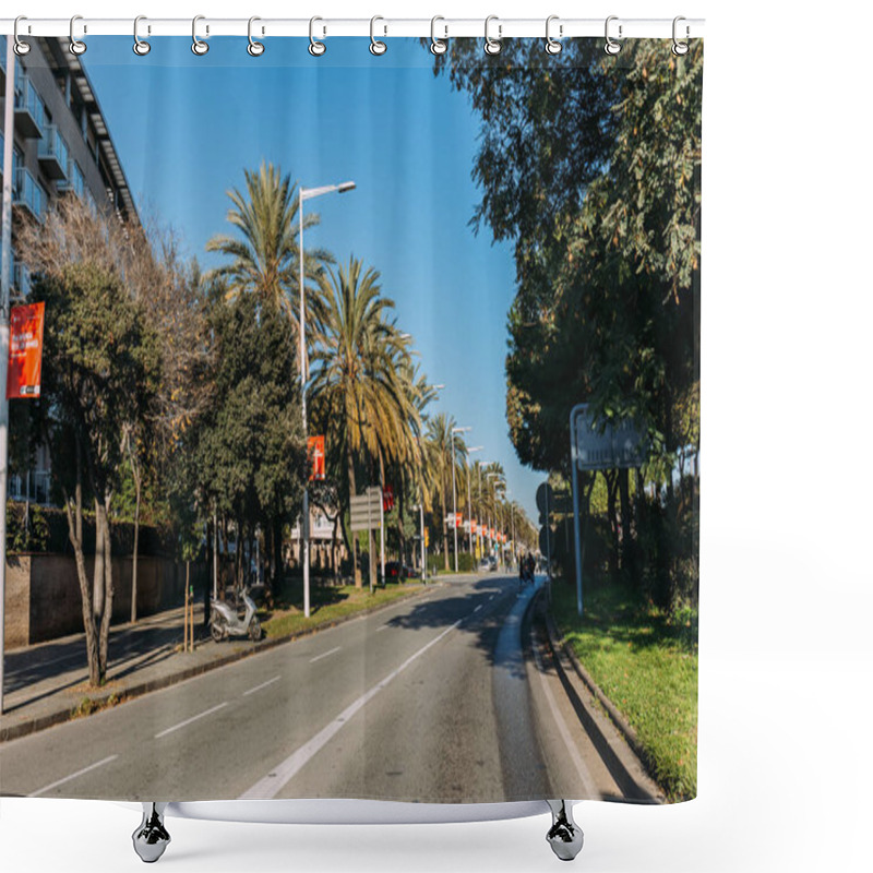 Personality  BARCELONA, SPAIN - DECEMBER 28, 2018: Cozy Street With Green Trees Growing Along Roadway Shower Curtains