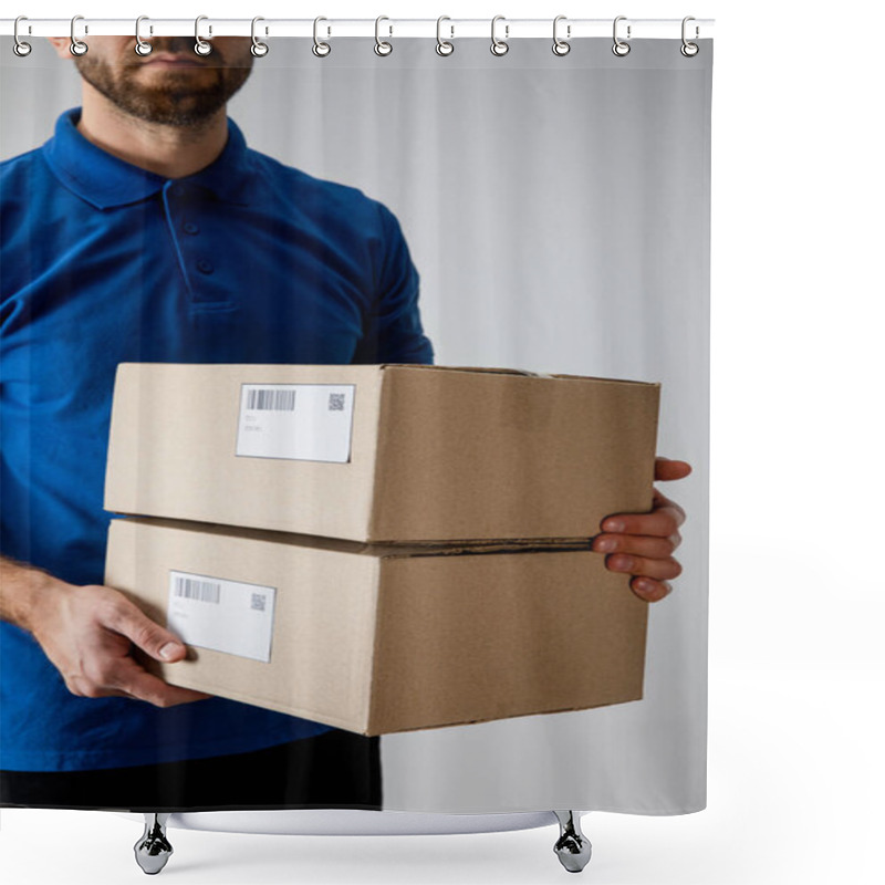 Personality  Cropped View Of Courier Holding Cardboard Boxes With Qr Codes And Barcodes Isolated On Grey Shower Curtains