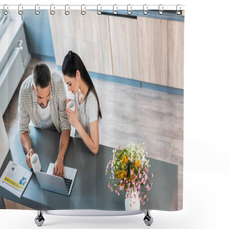 Personality  High Angle View Of Married Couple With Cups Of Coffee Using Laptop Together At Counter In Kitchen Shower Curtains