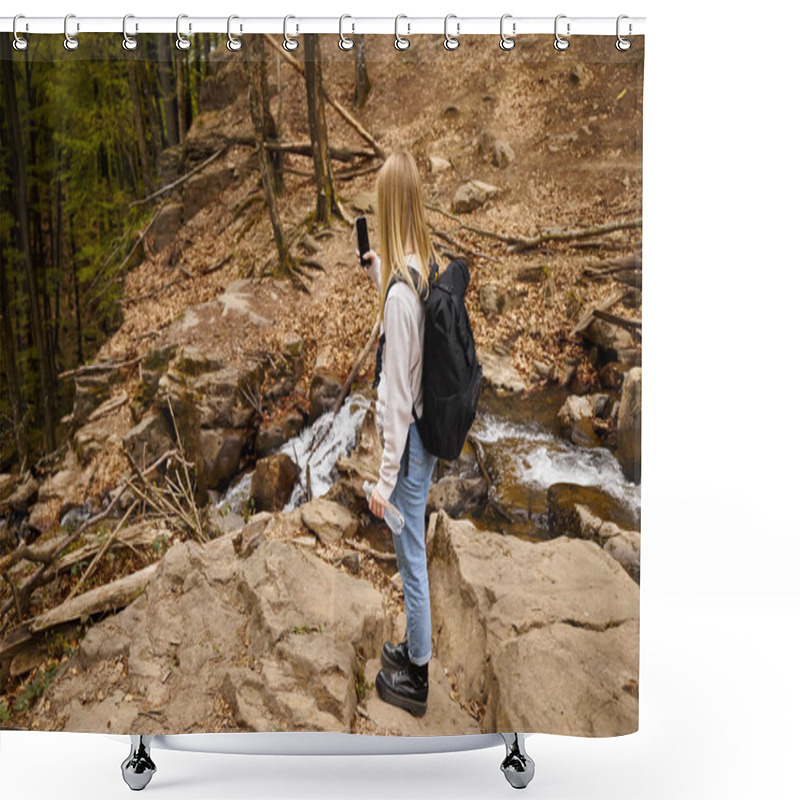 Personality  Back View Of Woman Traveler Wearing Sweater And Jeans Crossing The Forest Holding Bottle Of Water Shower Curtains