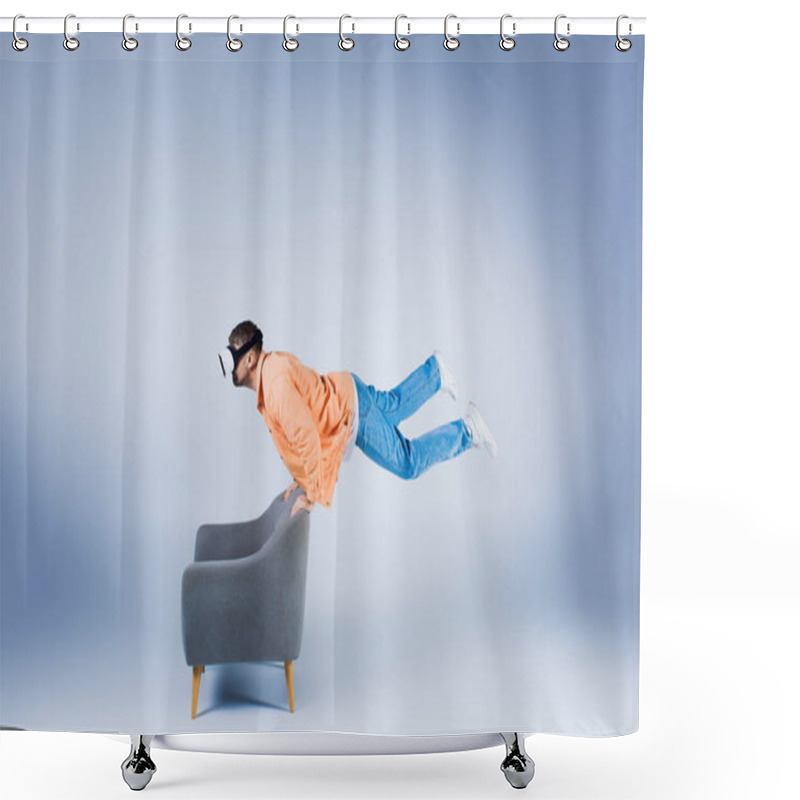 Personality  A Man In An Orange Shirt And Vr Headset Showcases His Agility, Balancing And Performing A Trick On A Chair In A Studio Setting. Shower Curtains