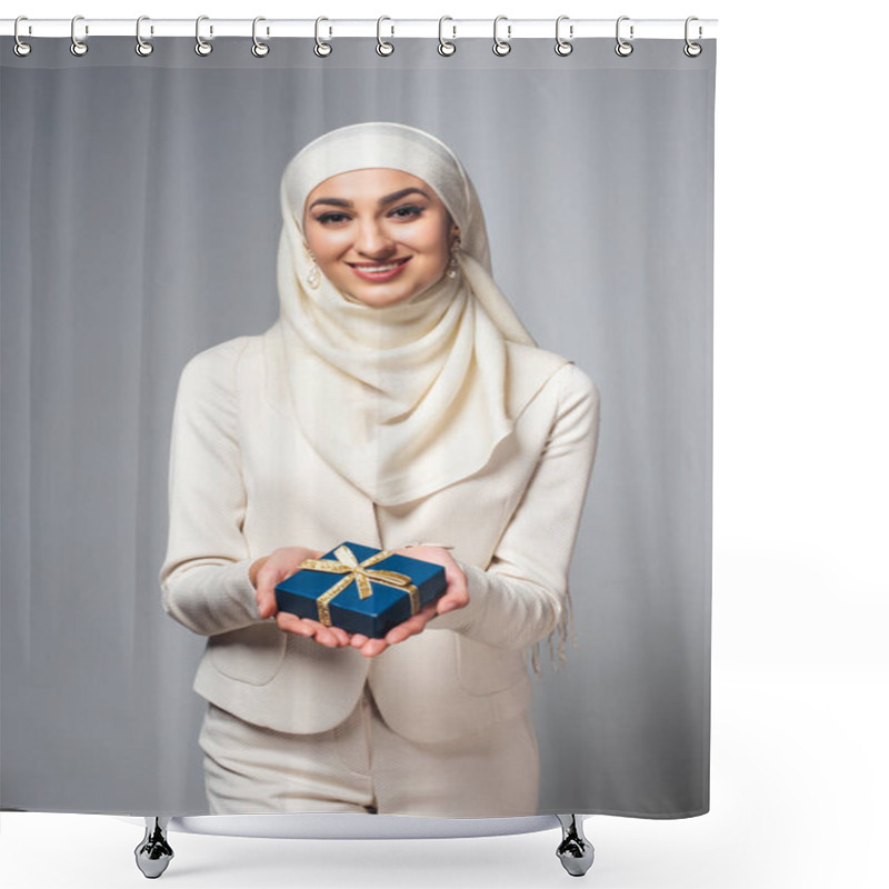 Personality  Happy Young Muslim Woman Holding Gift Box And Smiling At Camera Isolated On Grey Shower Curtains