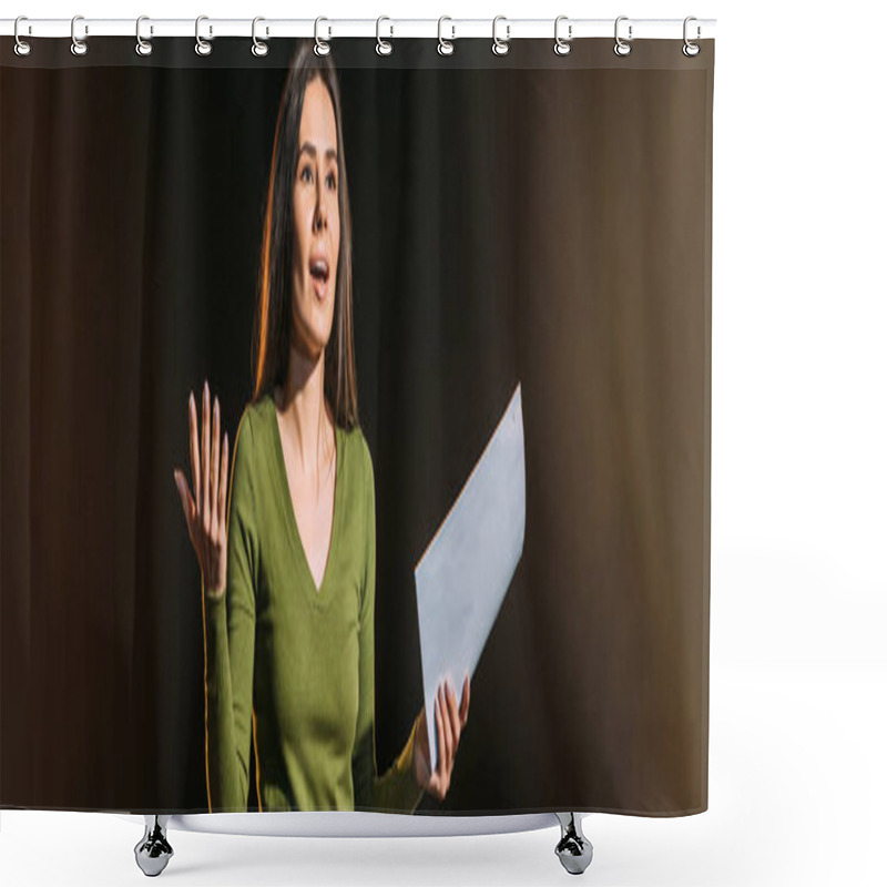 Personality  Panoramic Shot Of Attractive Young Actress Reading Scenario On Black Shower Curtains