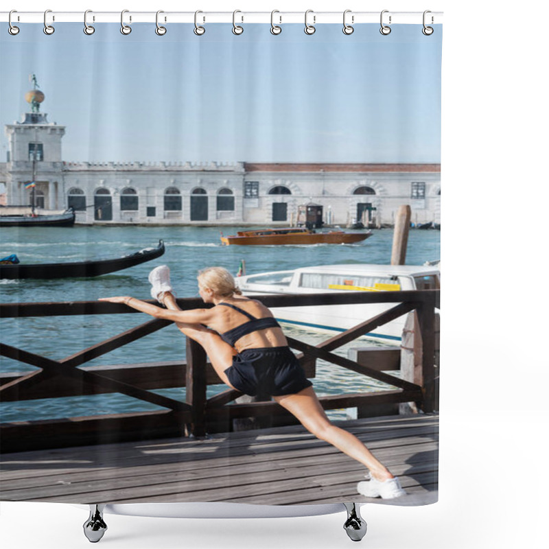 Personality  Fit Sportswoman In White Sneakers, Black Crop Top And Shorts Stretching On Wooden Pier With Boats At Background In Venice  Shower Curtains