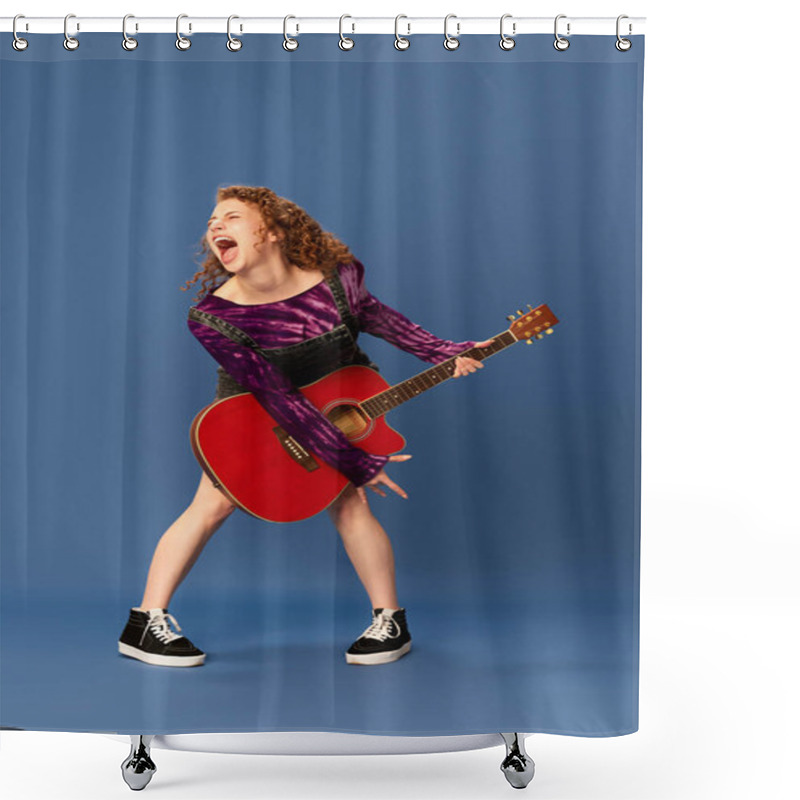 Personality  Shouting, Singing. Burst Of Energy. Portrait Of Young Emotional Girl Playing Guitar, Having Fun Against Blue Studio Background. Concept Of Human Emotions, Youth Culture, Fashion, Creative Lifestyle Shower Curtains