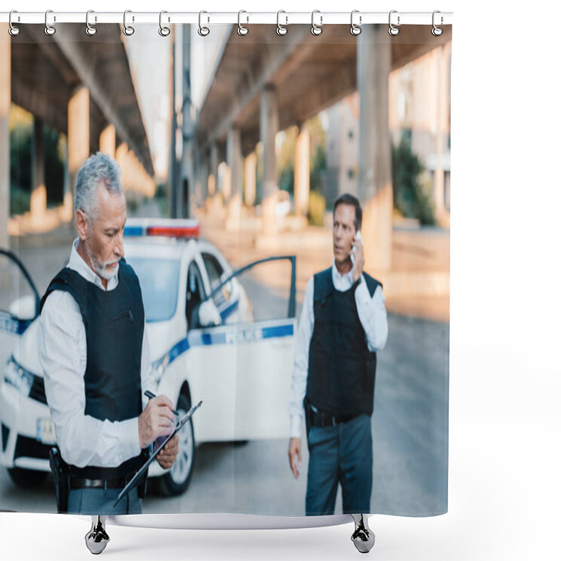 Personality  Middle Aged Police Officer Writing In Clipboard While His Colleague Talking On Smartphone At Street  Shower Curtains