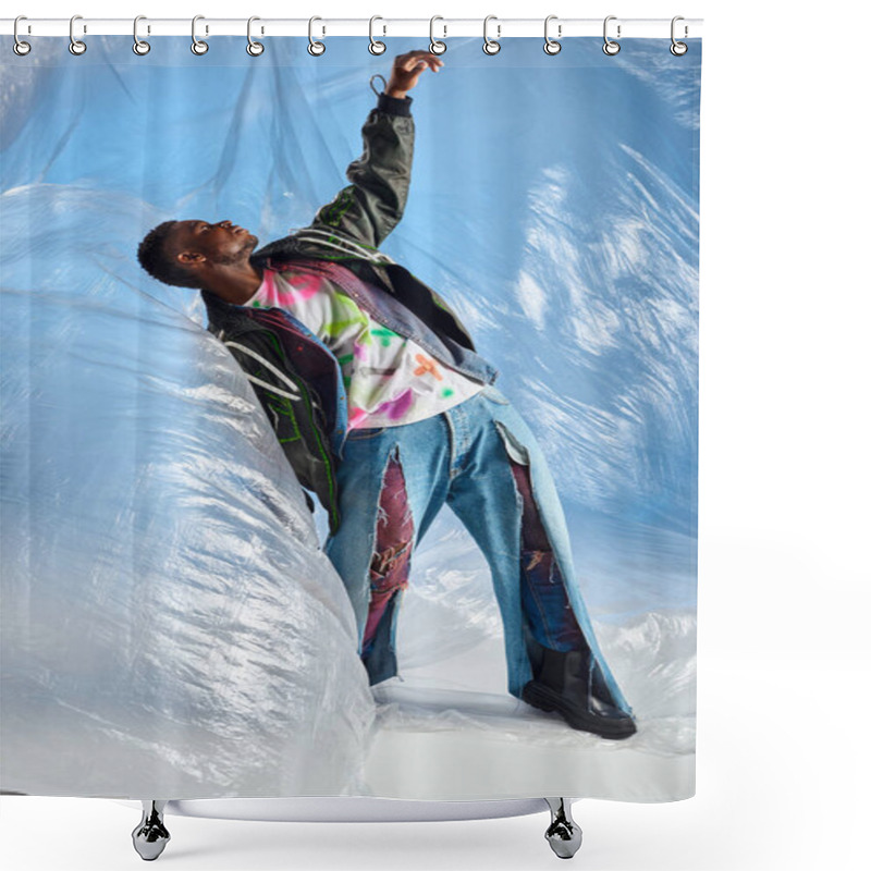 Personality  Side View Of Good Looking Afroamerican Male Model In Outwear Jacket With Led Stripes And Ripped Jeans Standing On Glossy Cellophane On Blue Background, DIY Clothing, Sustainable Lifestyle  Shower Curtains