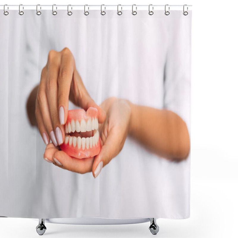 Personality  The Dentist Is Holding Dentures In His Hands. Dental Prosthesis In The Hands Of The Doctor Close-up. Front View Of Complete Denture. Dentistry Conceptual Photo. Prosthetic Dentistry. False Teeth Shower Curtains