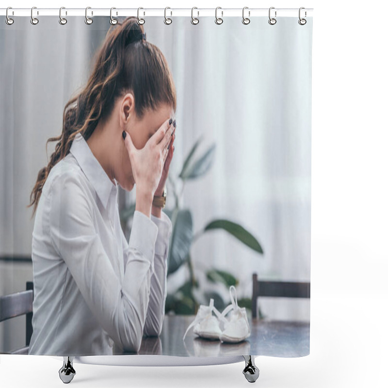 Personality  Upset Woman In White Blouse Sitting At Table With Baby Shoes And And Covers Face By Hands At Home, Grieving Disorder Concept Shower Curtains