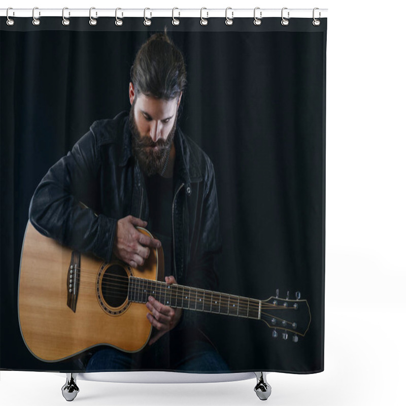 Personality  Young Bearded Man Sitting And Playing An Acoustic Guitar Over Black Background. Shower Curtains