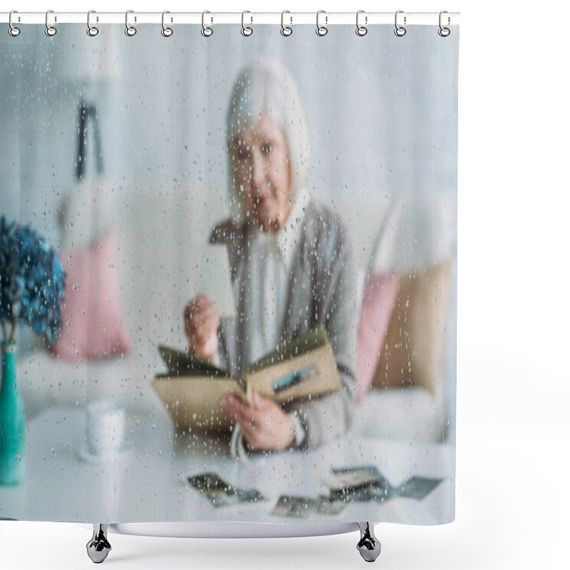 Personality  Selective Focus Of Senior Woman Looking At Photographs In Photo Album At Table With Cup Of Coffee At Home Shower Curtains