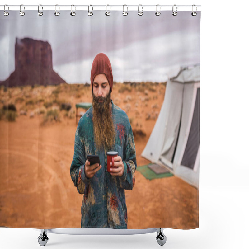 Personality  Attractive Bearded Guy With Cup Of Hot Beverage Using Modern Smartphone While Standing Not Far From Tent On Cloudy Day In Monument Valley, Utah Shower Curtains