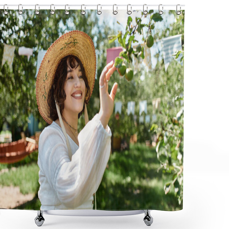 Personality  A Young Woman With Dark Hair, Wearing A Straw Hat And A White Blouse, Reaches Up To Pluck Fruit From A Tree In A Lush Summer Garden. Shower Curtains