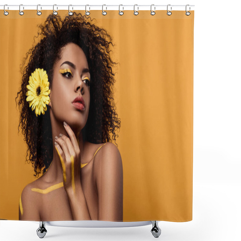 Personality  Young Sensual African American Woman With Artistic Make-up And Gerbera In Hair Holds Hand By Her Face Isolated On Orange Background Shower Curtains