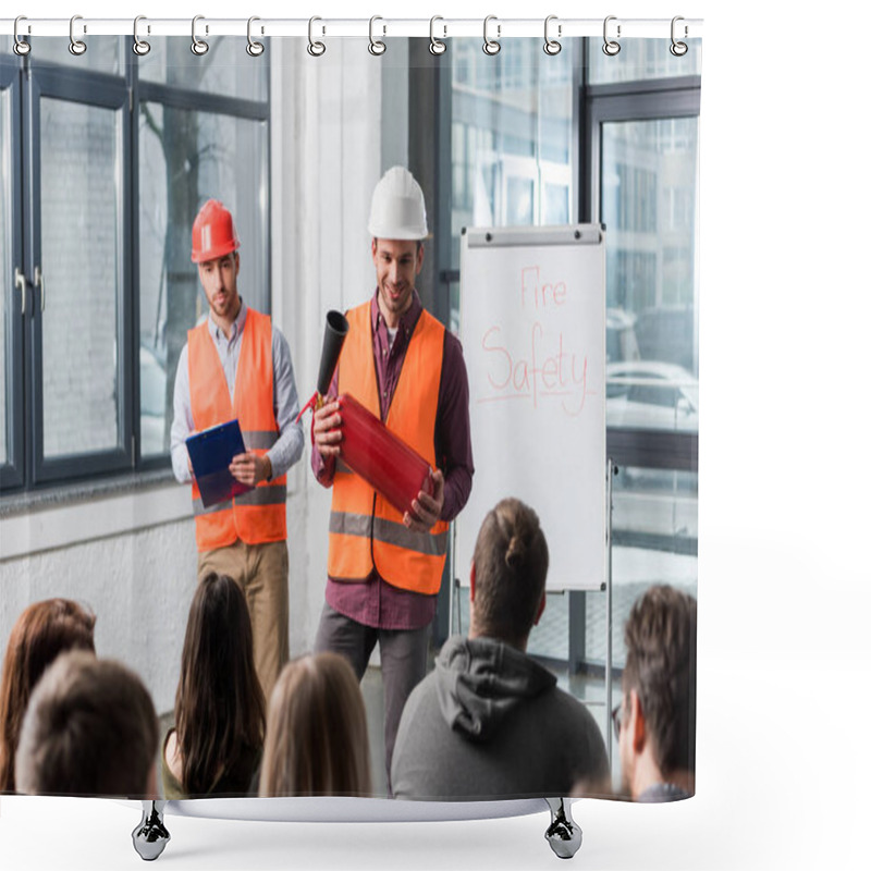 Personality  Selective Focus Of Handsome Firemen In Helmets Standing Near White Board With Fire Safety Lettering And Holding Extinguisher And Clipboard In Hands Shower Curtains