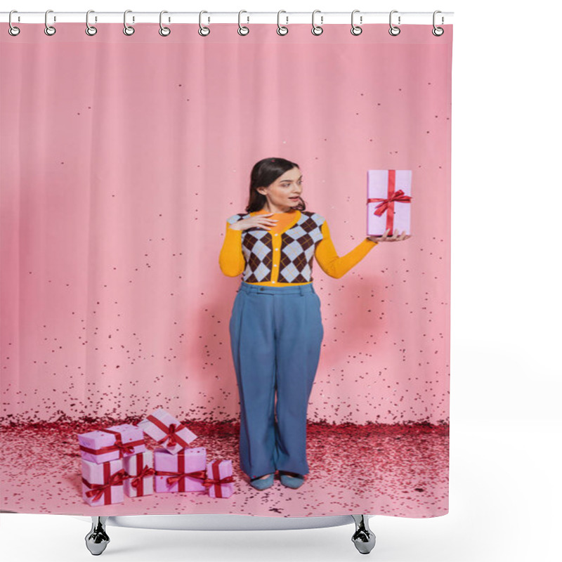 Personality  Surprised Woman In Blue Pants And Trendy Cardigan Looking At Present Near Festive Confetti And Gift Boxes On Pink Background Shower Curtains