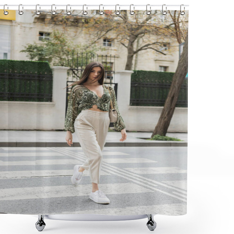 Personality  Stylish Woman With Brunette Long Hair In Trendy Outfit With Beige Pants, Cropped Blouse And Handbag With Chain Strap Walking On Crosswalk Of Urban Street In Istanbul, Blurred House On Background  Shower Curtains