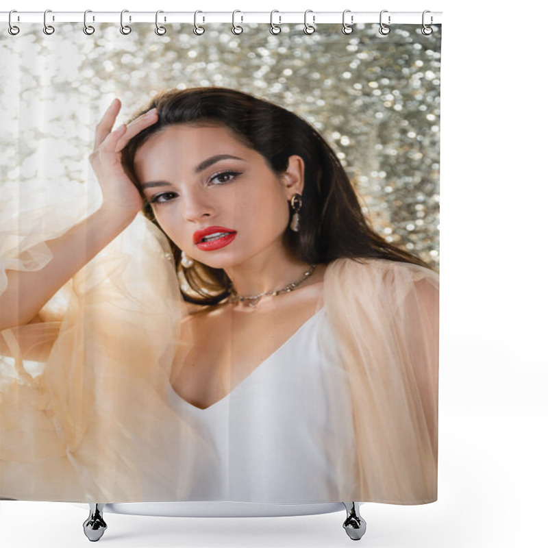 Personality  Brunette Woman In Elegant Tulle Dress Holding Hand Near Head And Looking At Camera On Glitter Background Shower Curtains