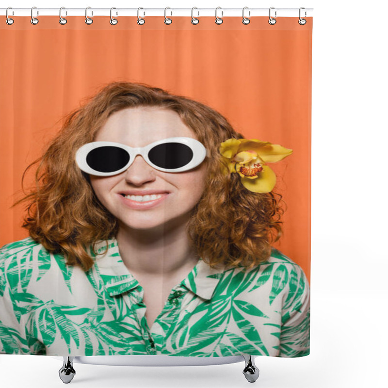 Personality  Smiling Young Woman With Orchid Flower In Red Hair Wearing Sunglasses And Blouse With Floral Print While Standing Isolated On Orange, Stylish Casual Outfit And Summer Vibes Concept, Youth Culture Shower Curtains