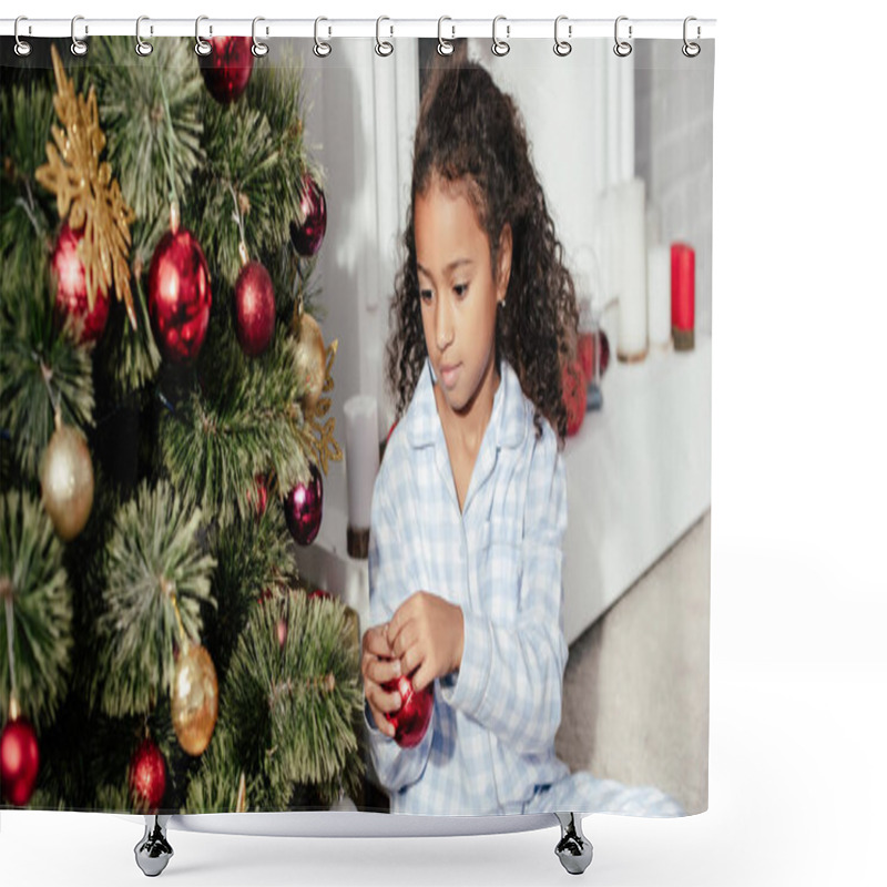 Personality  Adorable African American Child In Pajamas Decorating Christmas Tree With Red Balls At Home Shower Curtains