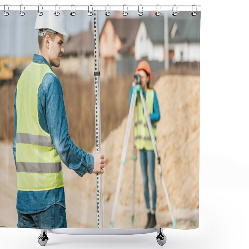 Personality  Selective Focus Of Surveyor With Ruler And Colleague With Digital Level On Background Shower Curtains