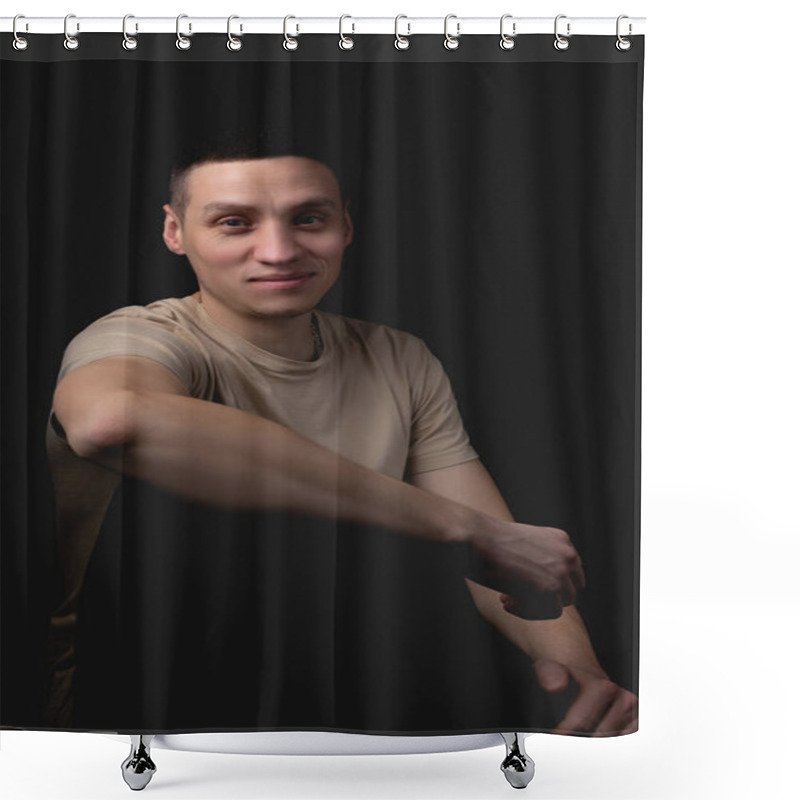 Personality  Handsome Young Man Posing Over Black Background. Studio Photo With One Light Source. Smiling Guy Cheerfully Posing In The Studio. A Cheerful Guy Sits With His Elbow On His Knee. Shower Curtains