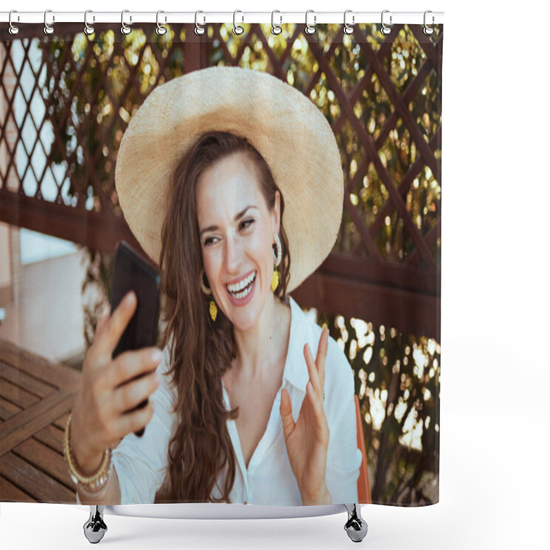 Personality  Happy Modern 40 Years Old Woman In White Shirt With Hat Having Webcam Meeting On A Smartphone In The Terrace Of Guest House Hotel. Shower Curtains